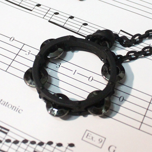 Tambourine motive necklace